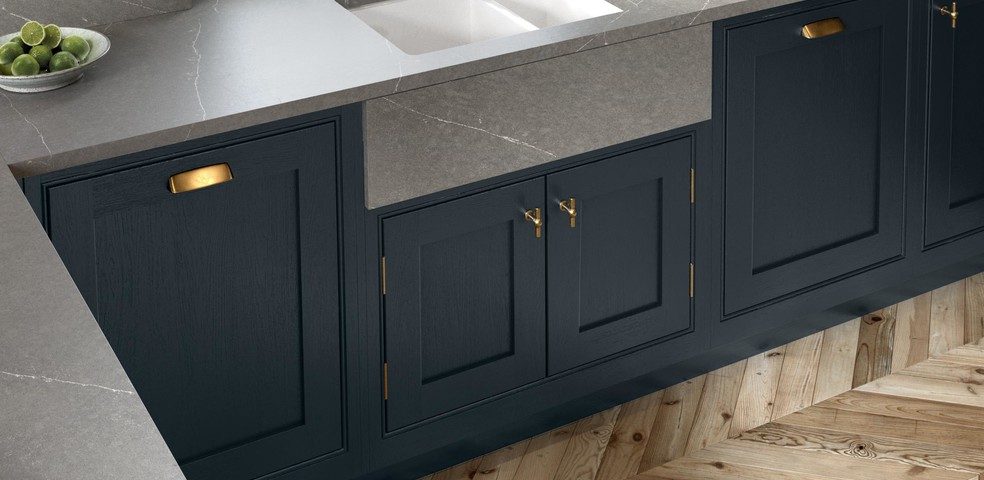 Dark painted cabinet panels with worktop and surface detailing