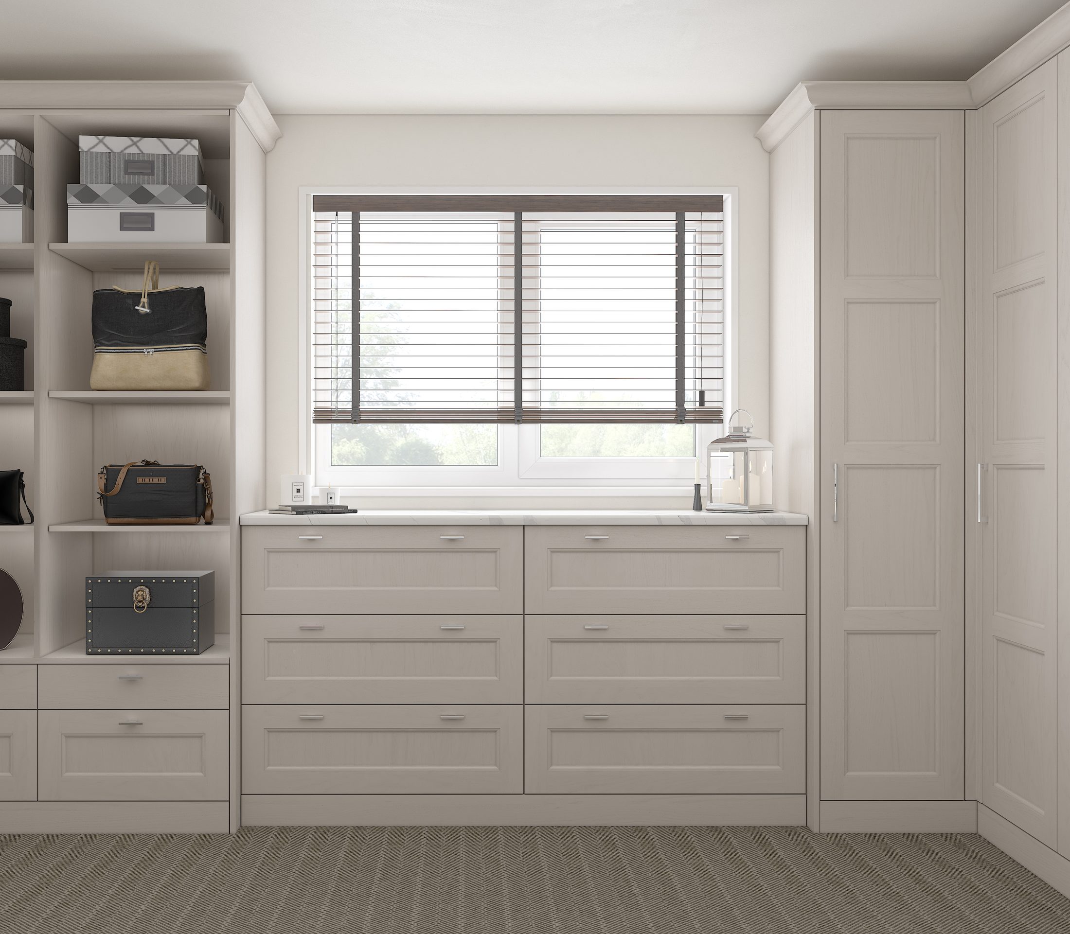 Pale fitted storage wall with drawers and open shelving